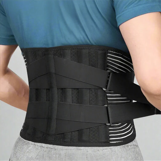 Person wearing a black waist support belt on a plain background